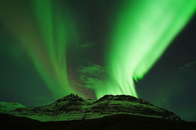 Scenic view of mountains against sky at night