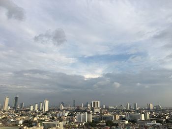 Modern buildings in city against sky