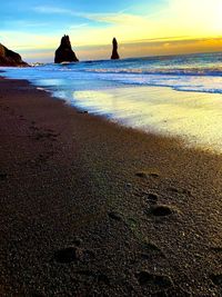 Scenic view of sea against sky during sunset