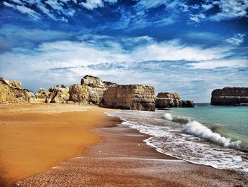 Scenic view of sea against cloudy sky