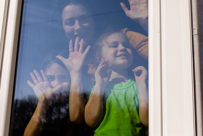 Reflection of woman in glass window