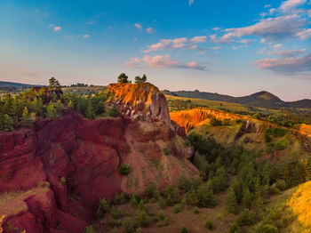 Rock formations on landscape against sky