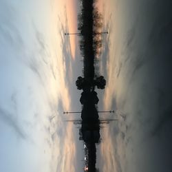 Silhouette plants against sky at sunset