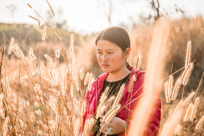 Close-up of woman standing on field