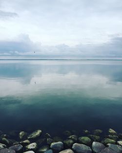 Scenic view of calm sea against sky