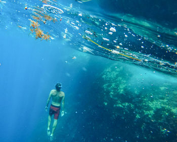 Man swimming in sea