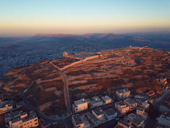 High angle view of buildings in city against sky