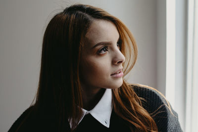 Portrait of young woman looking away