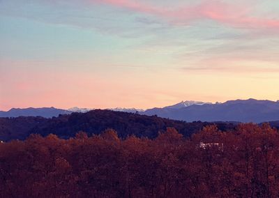 Scenic view of mountains against sky during sunset