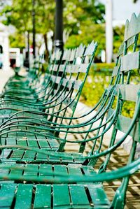 Close-up of empty chairs in row