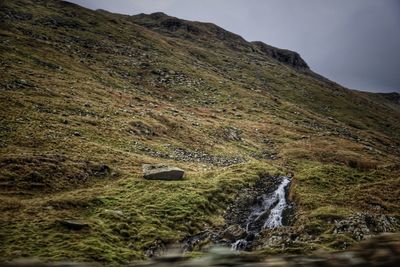 Scenic view of stream flowing through rocks