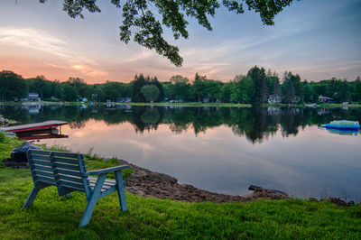 Scenic view of lake against sky at sunset