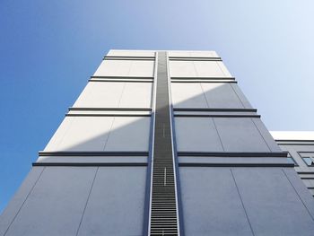 Low angle view of skyscraper against clear sky