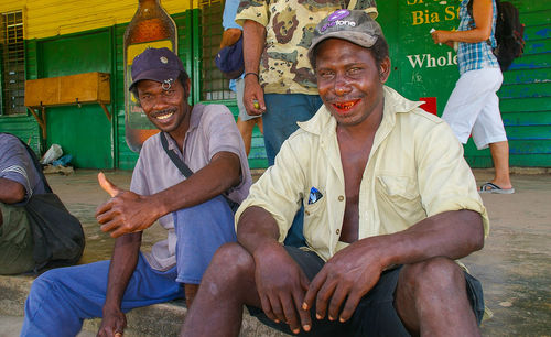 Portrait of smiling man sitting outdoors