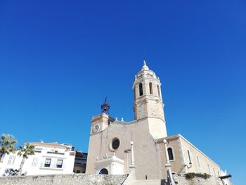 Low angle view of building against blue sky