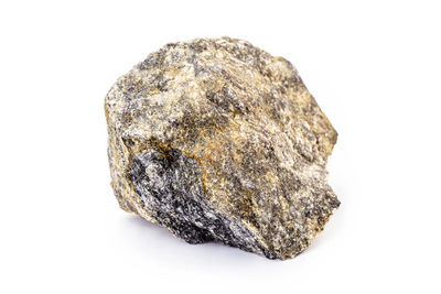 Close-up of rock against white background