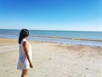 Scenic view of beach against clear sky