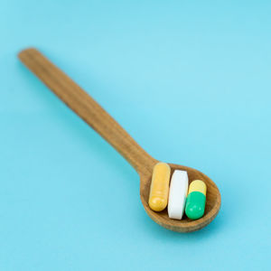 High angle view of candies on table against blue background