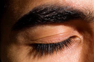 Close up portrait of the eye of a man with his eyes closed