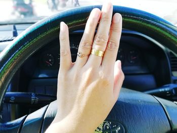 Midsection of woman in car