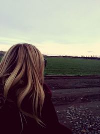 Silhouette of woman against sky