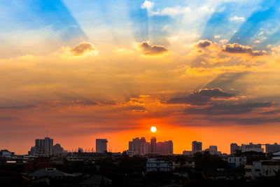 Buildings against sky during sunset