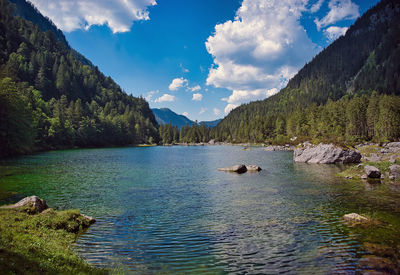 Scenic view of lake and mountains against sky