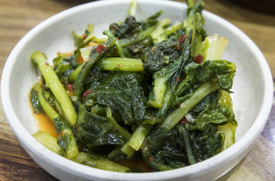 Close-up of green vegetable served in plate on table
