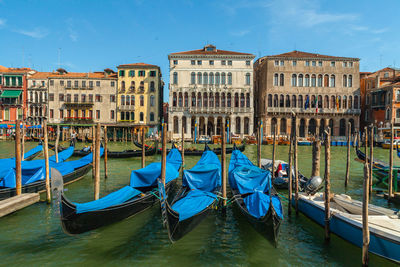 Boats moored in canal