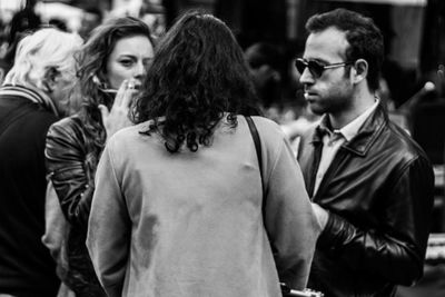 Friends standing on footpath