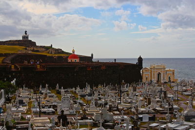 El morro castle and san juan cemetery against cloudy sky