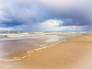 Scenic view of beach against sky