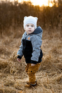 Boy wearing hat on field