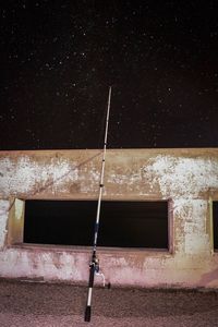 Low angle view of building against sky at night