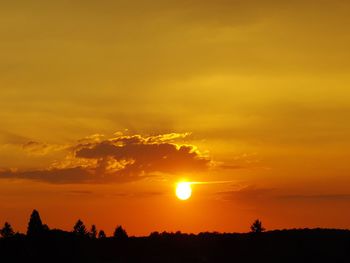 Scenic view of silhouette landscape against romantic sky at sunset