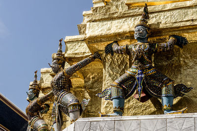 Low angle view of statue against building