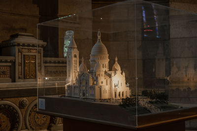 View of historic building seen through window