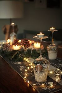 Close-up of tea light candles on table