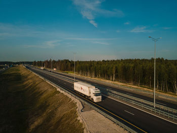 Train on road against sky