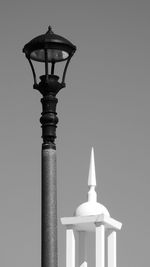 Statue against sky in city