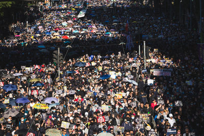 High angle view of people walking on street in city