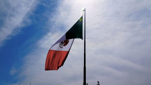 Low angle view of mexican flag against sky