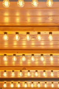 Full frame shot of illuminated light bulbs