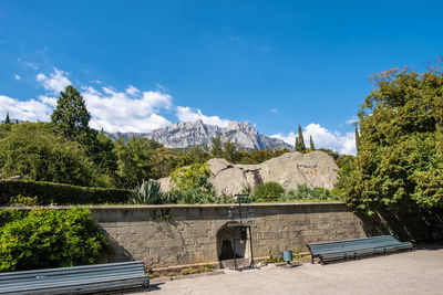 Scenic view of mountains against blue sky