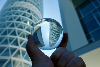 Cropped hand holding crystal ball