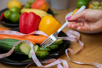 Cropped hand of person holding food