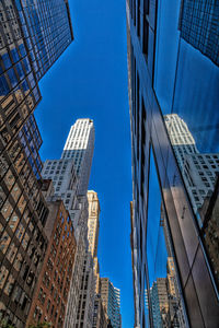 Low angle view of modern buildings in city