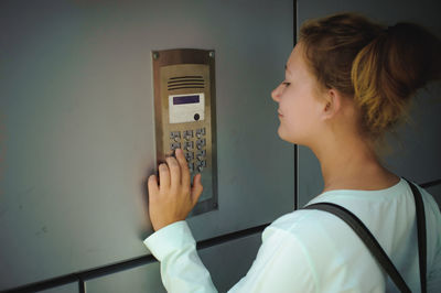 Close-up of young woman using mobile phone