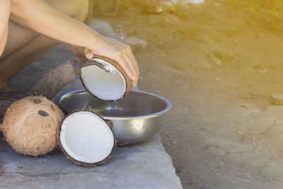 Midsection of woman holding food