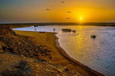 Scenic view of sea against sky during sunset